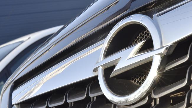 The famous “lightning” Opel badge could soon be owned by the Peugeot-Citroen group. Picture: AP Photo/Martin Meissner.