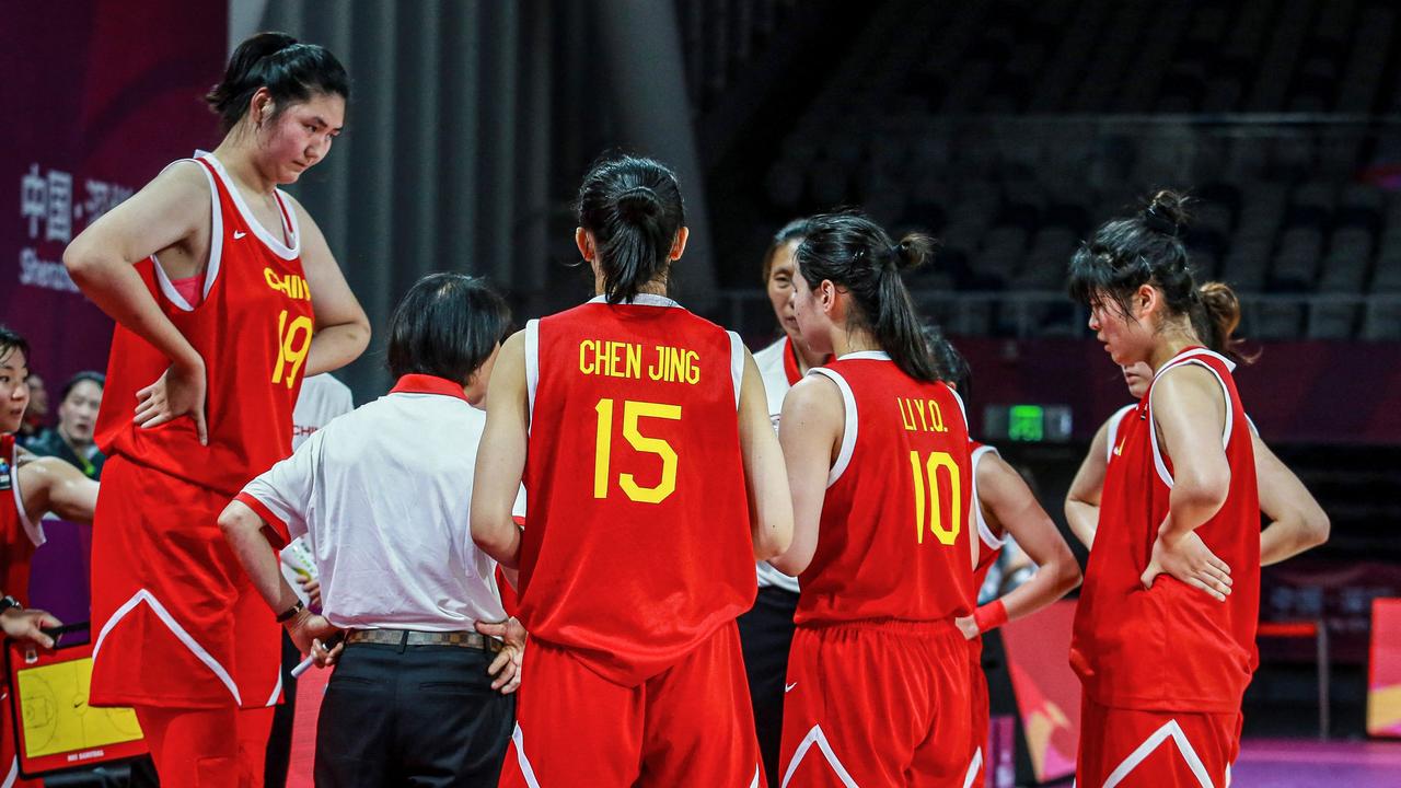 The towering teen is taking over the basketball world. (Photo by AFP)