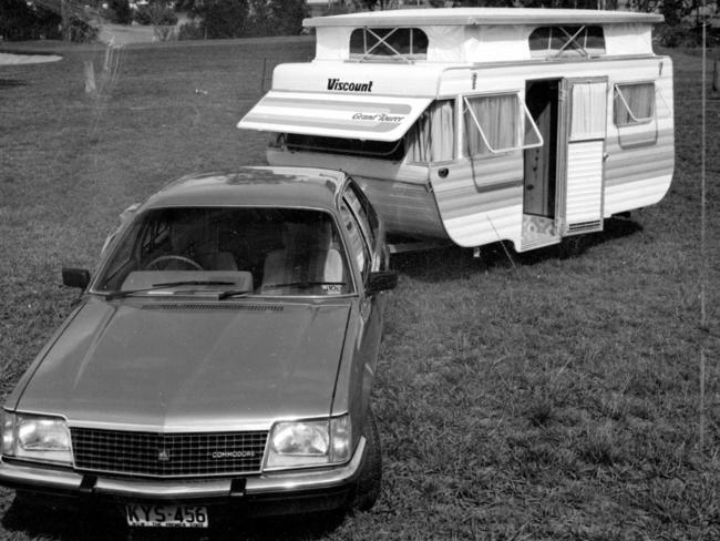 Viscount pop-up caravan being towed by Holden Commodore sedan in early 1980s.