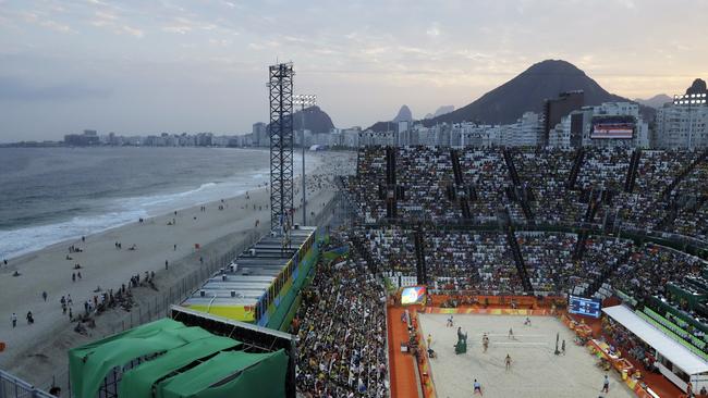 A view of Rio’s Copacabana beach and the Olympic beach volleyball stadium at dusk. Australian athletes have been banned from going on the sand at Copacabana and Ipanema after 6pm.