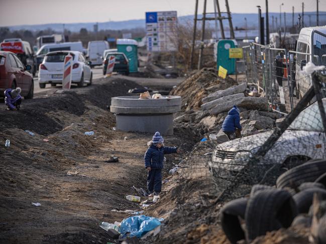 Children play with bricks as their families wait for relatives to cross the border in Medyka, Poland. Picture: Omar Marques/Getty Images