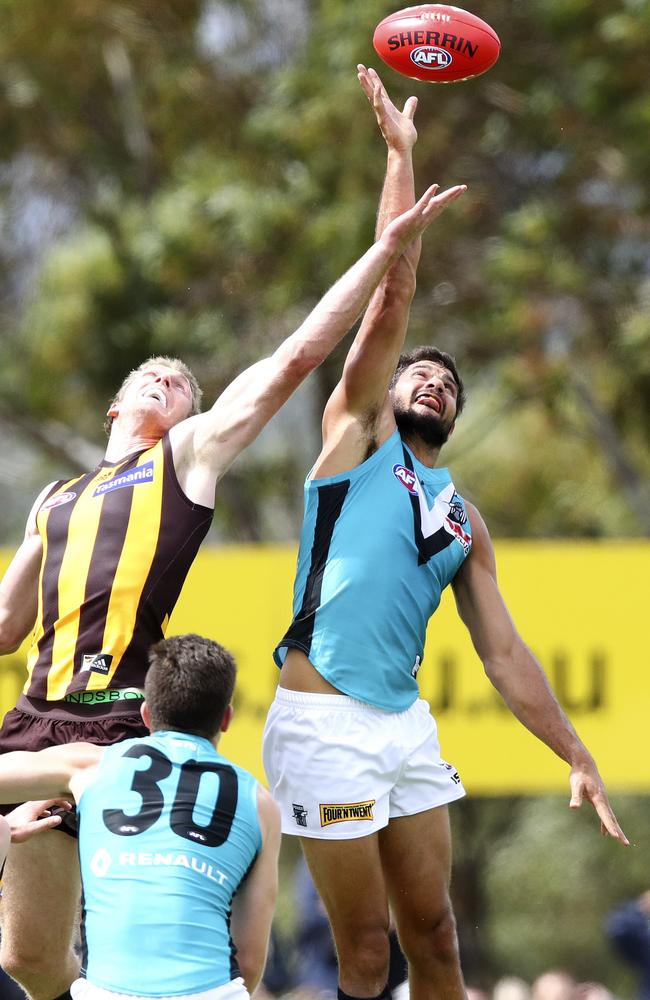 Port Adelaide’s Paddy Ryder wins the tap against Hawthorn’s Ben McEvoy. Picture Sarah Reed