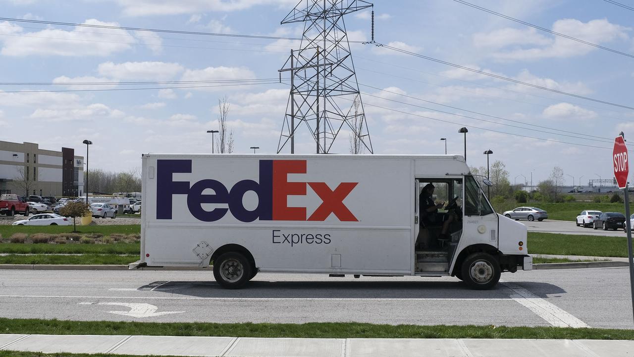 A FedEx truck drives past the site of a mass shooting in Indianapolis, Indiana on Friday, the morning after the massacre. Picture: Jeff Dean/AFP