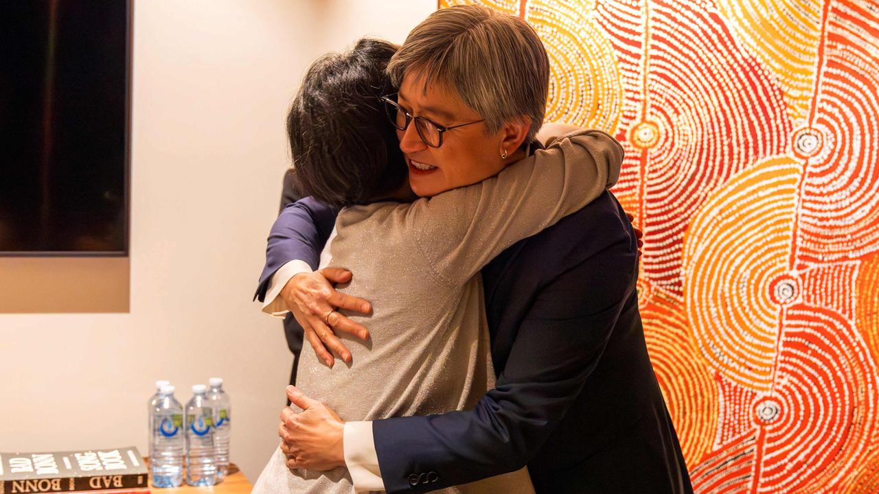 Foreign Minister Penny Wong (R) hugging Australian journalist Cheng Lei upon her arrival at the airport in Melbourne. Picture Sarah Hodges / Department of Foreign Affairs and Trade (DFAT) / AFP) /