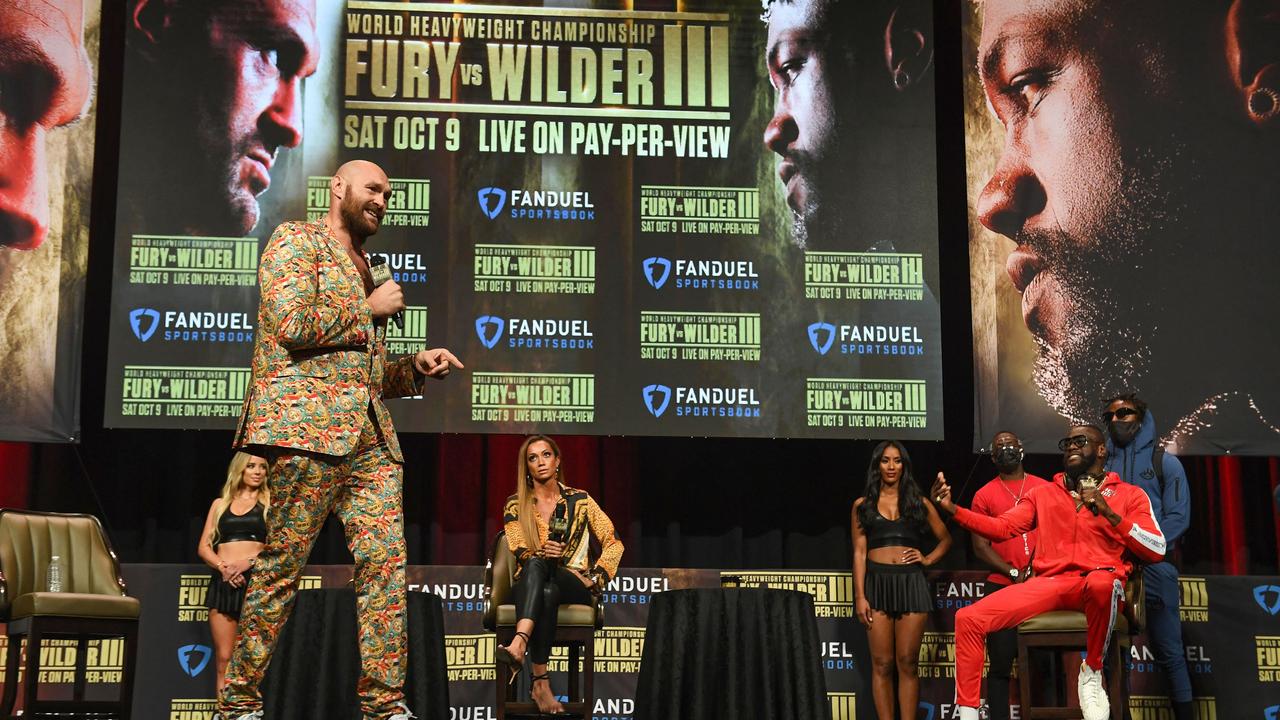 British boxer Tyson Fury (L) and challenger US boxer Deontay Wilder attend a press conference for their WBC heavyweight championship fight, October 6, 2021. Photo: AFP