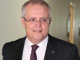 Treasurer Scott Morrison walks to Ch9 studios at Parliament House in Canberra this morning to be interviewed by Laurie Oaks. Picture: Ray Strange.