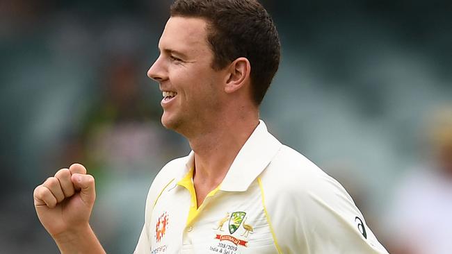 Australia’s Josh Hazlewood celebrates taking the wicket of India’s Mohammed Shami with the first ball of the day on Friday. Picture: Getty