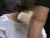 Mum accused of brutal double stabbing fronts court