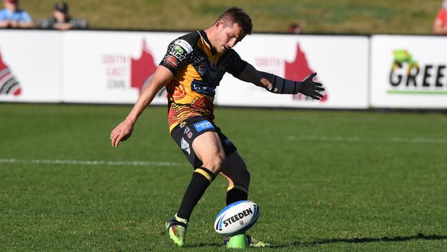 Sunshine Coast Falcons against PNG Hunters rugby league match. Falcons halfback Todd Murphy kicks a goal.