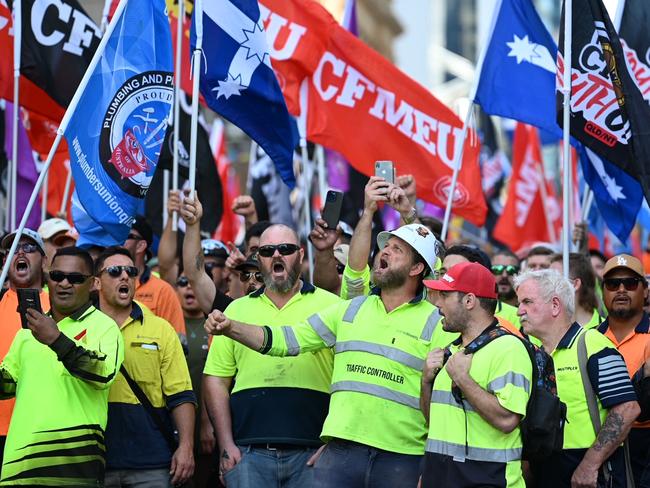 Hundreds of workers walked off the job today in Brisbane in protest of wage theft, sham contracting and insolvency causing a CBD traffic nightmare., Organisers CFMEU. The angry mob converged on the Waterfront Place where they wrote profanities on the windows and smashed a glass door. Police were quick to move the crowd away from the front of the building and the broken glass. The Waterfront Place is where the office of the Federal Government is located - photo Lyndon Mechielsen