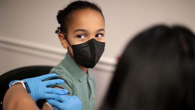 A child receives the Pfizer BioNTech COVID-19 vaccination in the US.