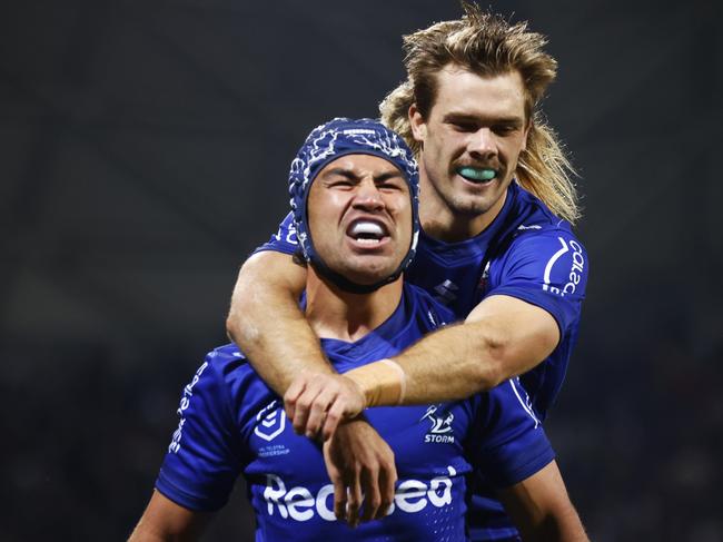 MELBOURNE, AUSTRALIA - APRIL 25: Jahrome Hughes of the Storm (L) celebrates scoring a try with Ryan Papenhuyzen of the Storm during the round seven NRL match between the Melbourne Storm and the New Zealand Warriors at AAMI Park, on April 25, 2022, in Melbourne, Australia. (Photo by Daniel Pockett/Getty Images)