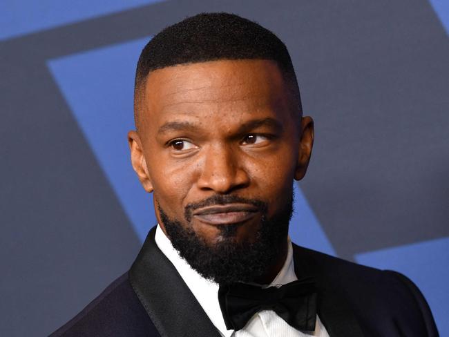 (FILES) US actor Jamie Foxx arrives to attend the 11th Annual Governors Awards gala hosted by the Academy of Motion Picture Arts and Sciences at the Dolby Theater in Hollywood on October 27, 2019. US actor Jamie Foxx made his first public appearance on December 4, 2023 in Hollywood since suffering a mysterious medical emergency, telling an award show that he had not been able to even walk six months ago. Making a surprise appearance at the Critics' Choice Association's Celebration of Cinema and Television in Los Angeles, Foxx said he had "been through some things." (Photo by Chris Delmas / AFP)