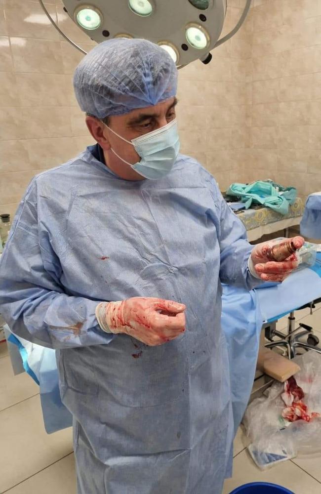 A surgeon with the removed grenade. Picture: Facebook