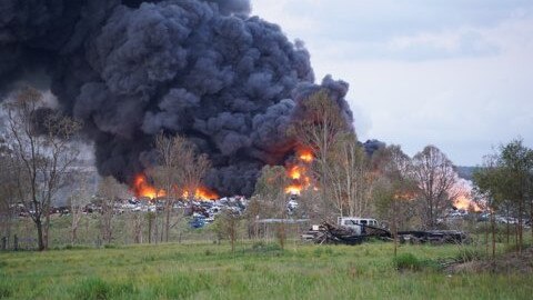 Firefighters have been battling a massive fire in a scrap metal car yard on Trenayr Rd at Trenayr in the Grafton area since 6PM. Picture: Jackson Whitney