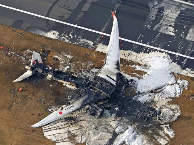 An aerial view shows burnt Japan Airlines' Airbus A350 plane after a collision with a Japan Coast Guard aircraft. Picture: Kyodo/via REUTERS