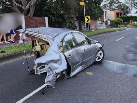 Miraculous Crash on Old Northern Road, Baulkham Hills:, A serious crash occurred on Old Northern Road x Hill St, Baulkham Hills. Details are still emerging, but initial reports indicate that one vehicle was completely cut in half, while the back end down the side of a house. Miraculously, the 18 year old male driver of the 2004 Mazda walked away from the scene.  However was arrested after returning a positive roadside breath test. Picture: NewsWire handout