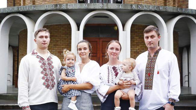 Ruslan Sovinsky, Emily Ilkiw holding daughter Bronte, Melissa Rohozynsky with daughter Kaia and Olexa Matiouk at the prayer service for Ukraine on Friday. Picture: Sam Ruttyn