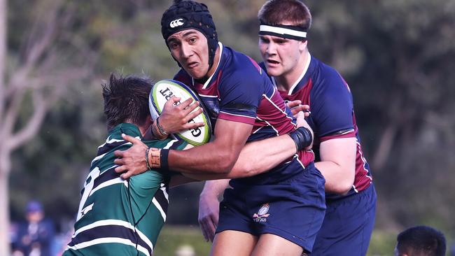 Syris Schmidt of TSS runs with the ball against BBC during their GPS Rugby clash. Photograph: Jason O'Brien