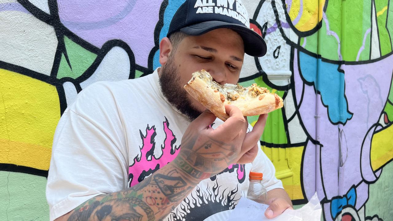 Happy customers chow down on flavours such as chicken and waffle and chopped cheese, which is a New York variation of the Philly cheesesteak. Picture: Benedict Brook/news.com.au