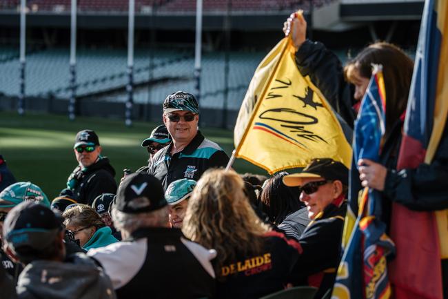 Crows and Port Adelaide fans sitting together on the southern side of Adelaide Oval as extras in film 
