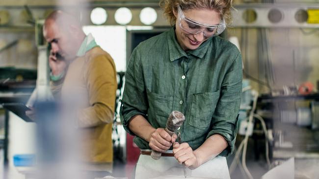 TRADESWOMAN/ TRADE WOMAN/ TRADESMAN/ TRADIE/BUILDING INDUSTRY: Stonecutter at his workshop, Ljubljana, Slovenia