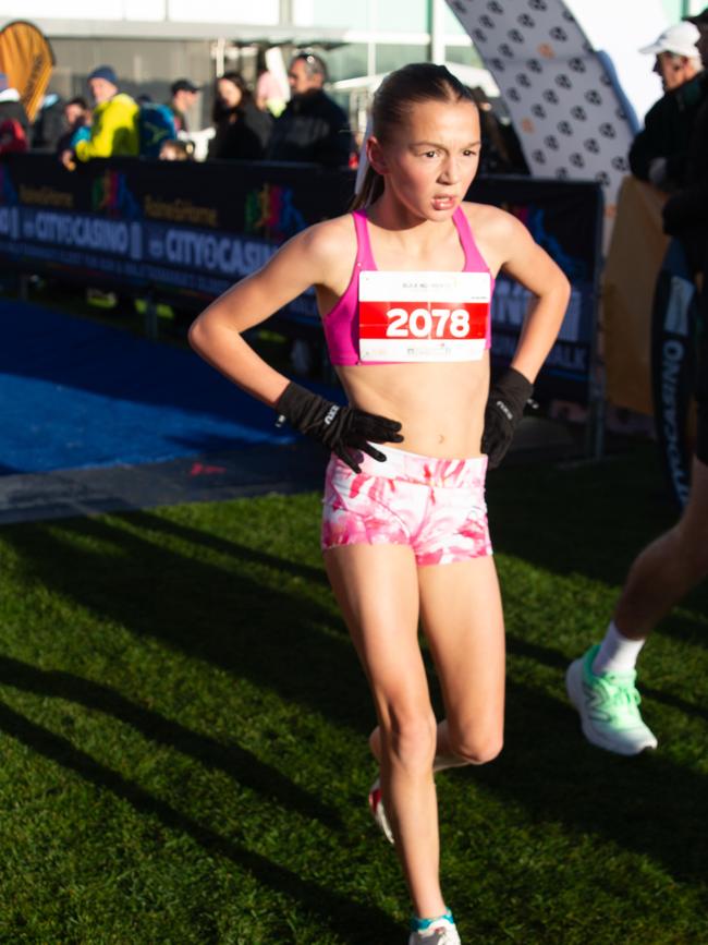 Stella Knighton crosses the finish line in second place for the female category in the 7km run at the City to Casino on Sunday 18th May 2025. Picture: Linda Higginson