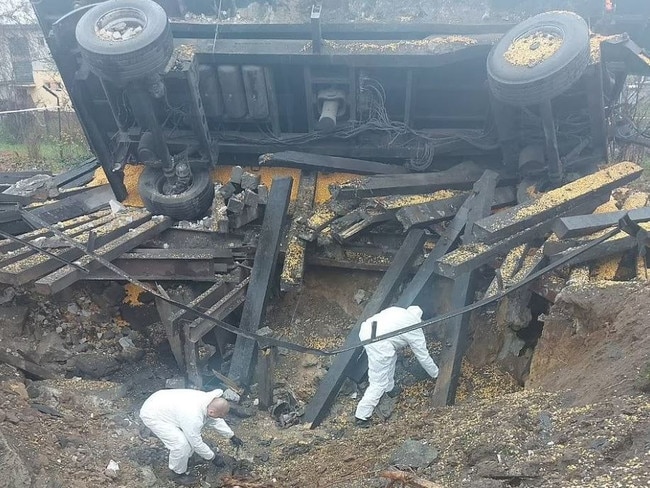 Investigators work after two missiles struck a Polish village. Picture: Polish police