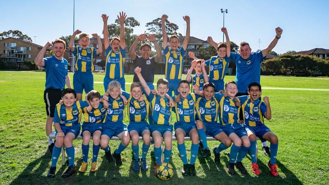 Manly Daily  / AAPDee Why Champion Soccer TeamNames to be sent to Amanda Lulham(back L-R) pose for a photo at Dee Why Oval, on Thursday, 17 October 2019.  Dee Why football team are playing in the Champions of Champions event this weekend.(AAP IMAGE / MONIQUE HARMER)