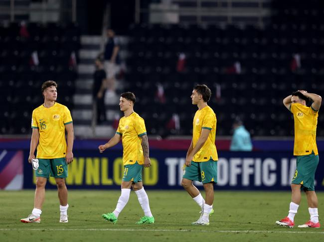 DOHA, QATAR - APRIL 21: Australia players react after the AFC U23 Asian Cup Group A match between Qatar and Australia at Jassim Bin Hamad Stadium on April 21, 2024 in Doha, Qatar.(Photo by Mohamed Farag/Getty Images)