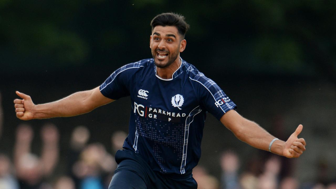 Safyaan Sharif held his nerve in the final over to earn Scotland a surprise tie.