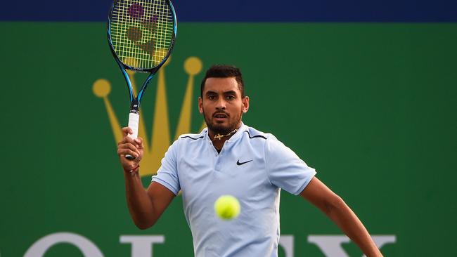 Nick Kyrgios of Australia hits a return during the men's singles against Steve Johnson of America at the Shanghai Masters tennis tournament in Shanghai on October 10, 2017. / AFP PHOTO / CHANDAN KHANNA