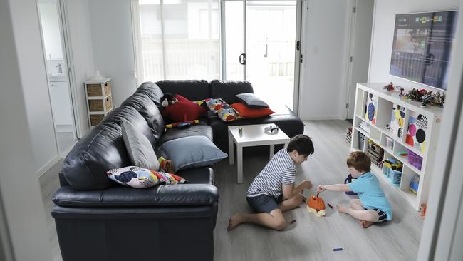 Ellis, 9, and Max, 3, play in the family room, which links their bedrooms and leads onto the backyard. Picture: Mark Cranitch