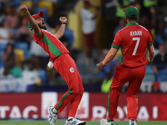 BRIDGETOWN, BARBADOS - JUNE 05: Aqib Ilyas of Oman celebrates after catching out Glenn Maxwell of Australia (not pictured) during the ICC Men's T20 Cricket World Cup West Indies & USA 2024 match between Australia  and Oman at  Kensington Oval on June 05, 2024 in Bridgetown, Barbados. (Photo by Matthew Lewis-ICC/ICC via Getty Images)