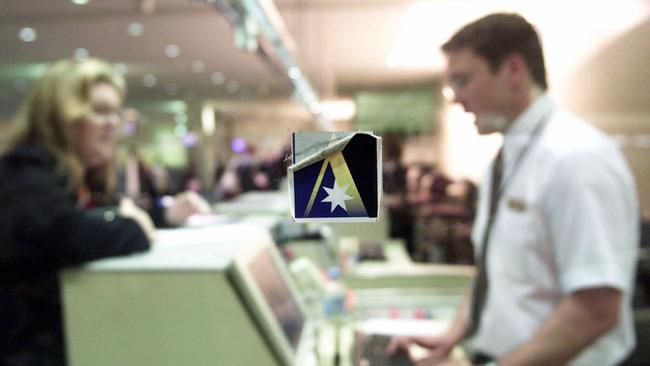 Passengers check in at an Ansett counter in 2001, shortly before the airline’s collapse.