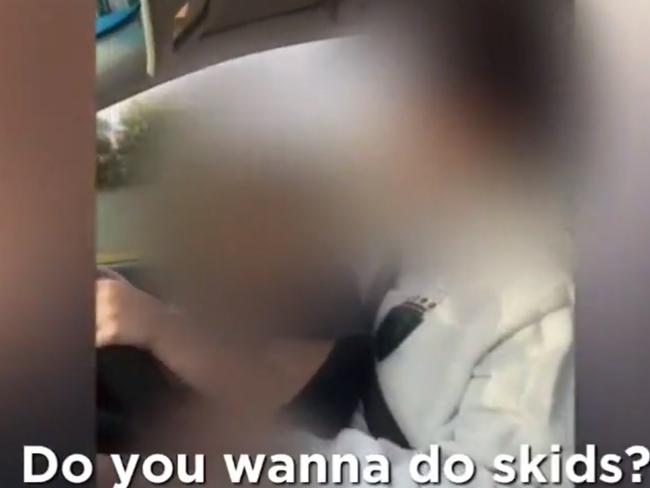 A driver has apologised after she was filmed with a small child on her lap controlling the wheel of a car in Adelaide's North. Picture: 9 News