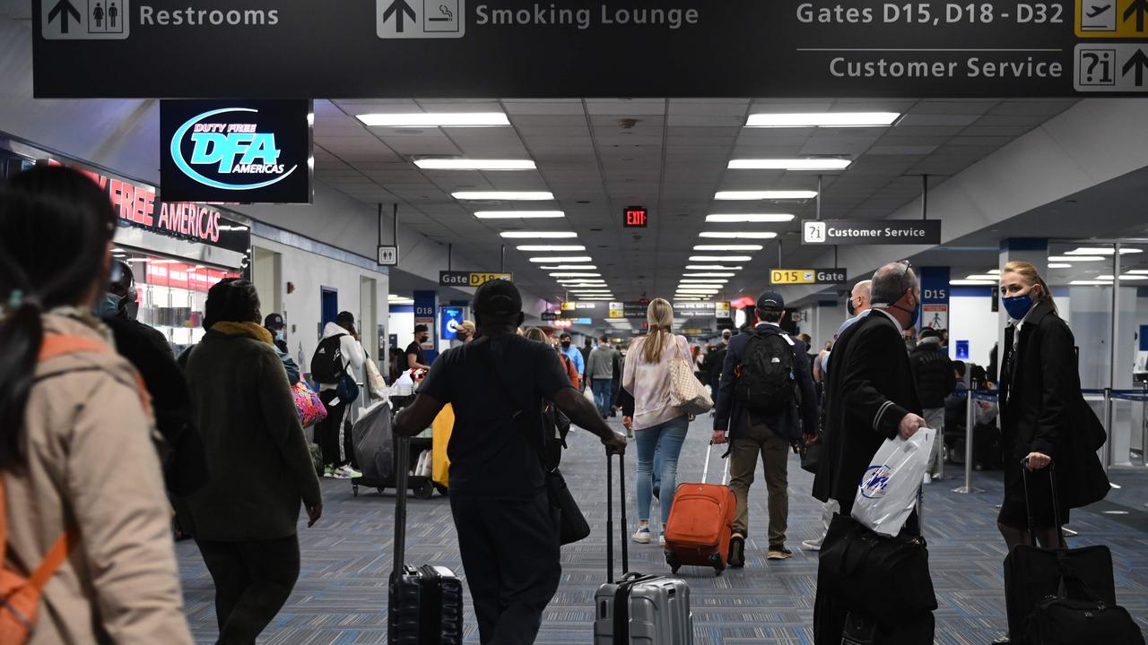 Passengers walk through a crowded terminal at Dulles Airport in Virginia on December 27. Source: Andrew Caballero-Reynolds/AFP