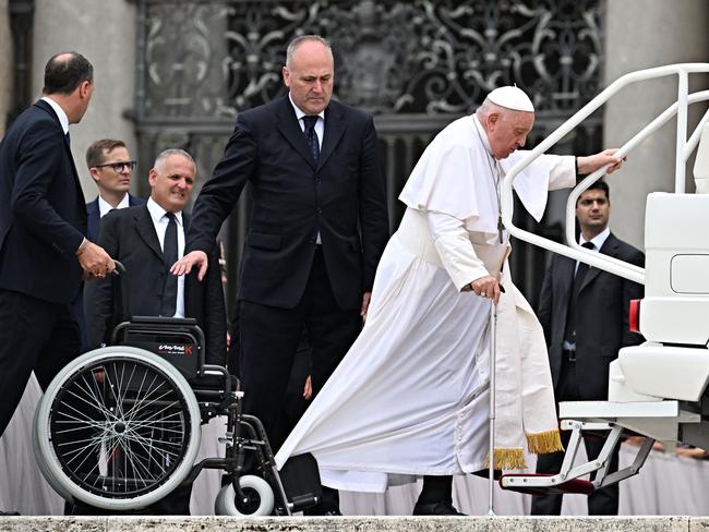 Pope Francis steps into the popemobile at the end of a private audience with Carabinieri's officers at the Vatican on September 16, 2023. (Photo by Andreas SOLARO / AFP)