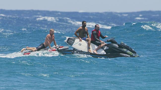 Surfers, Mick Fanning and Joel Parkinson using a jetski to catch waves at Snapper Rocks on Sunday 2 January 2022. Picture: Jerad Williams