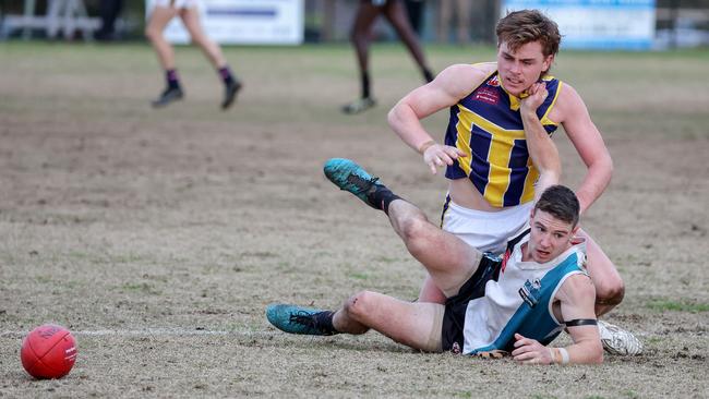 EDFL: Riley McLaughlin of Hillside battles with Rupertswood’s Mitchell Johnson. Picture: George Salpigtidis