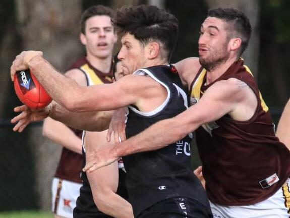 Ringwood captain Trent Farmer in brought down in a tackle in the Eastern Football League (EFL). Picture: Davis Harrigan