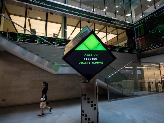 LONDON, ENGLAND - AUGUST 29: Financial market figures are shown on big screens and a ticker in the main entrance at London Stock Exchange on August 29, 2019 in London, England. The pound has come under renewed pressure after the government moved to prorogue parliament for five weeks, fueling fears of a no-deal Brexit. (Photo by Chris J Ratcliffe/Getty Images)