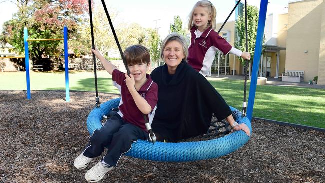 Annesley Junior principal Cherylyn Skewes with students Hudson, 7, and Scarlett, 4. Picture: Campbell Brodie