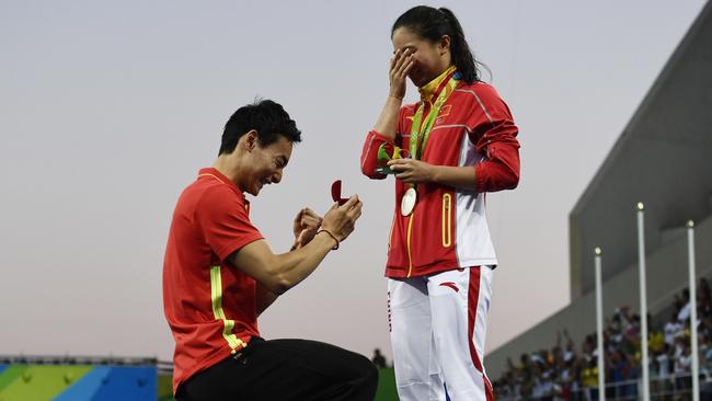 Risky business, proposing on live TV. Photo: AFP PHOTO/ CHRISTOPHE SIMON