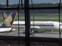(FILES) In this file photo taken on June 8, 2020, a Singapore Airlines passenger jet taxis along the tarmac as it arrives at Changi International Airport terminal in Singapore. - Singapore Airlines (SIA) reported a first-quarter net loss of more than $800 million USD on July 29, the latest carrier to take a massive hit as a result of the coronavirus pandemic. (Photo by Roslan RAHMAN / AFP)