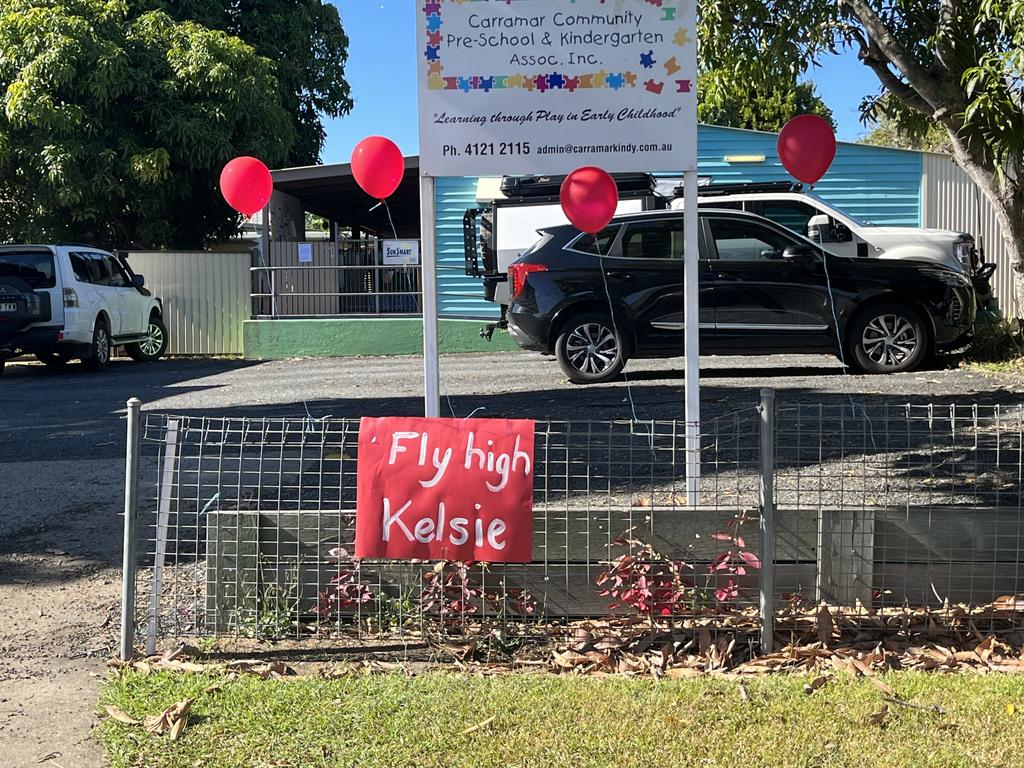 Across the road from Reach Church where Ms Davies’ funeral service was held, Carramar Community Pre-School and Kindergarten had tied red balloons, signifying her favourite colour, and placed a sign, “fly high Kelsie”.