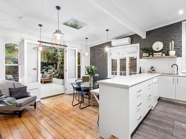 The kitchen and dining area of the Manly semi and the deck beyond.