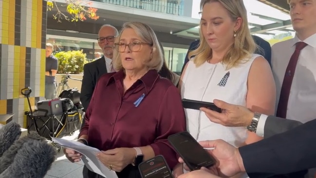 Sue Arnold speaks alongside family members of Constable Arnold and Constable McCrow