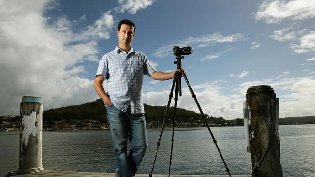 Jason Fardoulis with his top of the line Sony video camera — which doesn't work. Picture: Troy Snook
