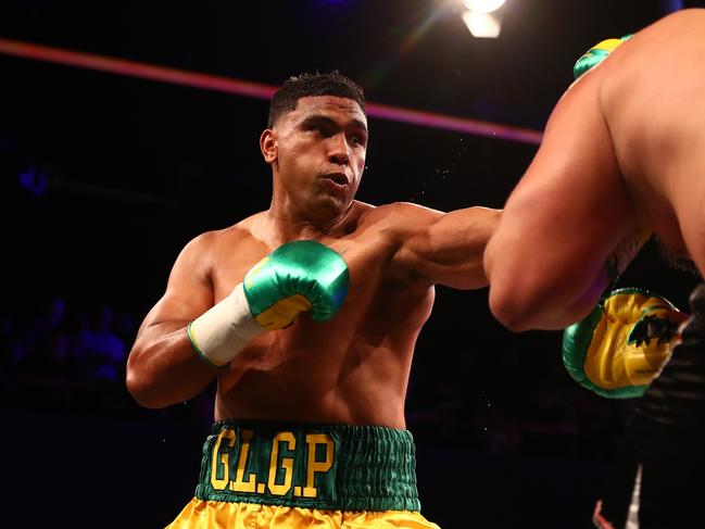 BRISBANE, AUSTRALIA - DECEMBER 04: Tevita Pangai Jr punches Gerico Cecil during the Heavyweight bout at Fortitude Music Hall on December 04, 2021 in Brisbane, Australia. (Photo by Chris Hyde/Getty Images)